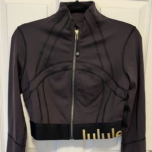 Lululemon cropped jacket, size 8. Black with gold detailing.